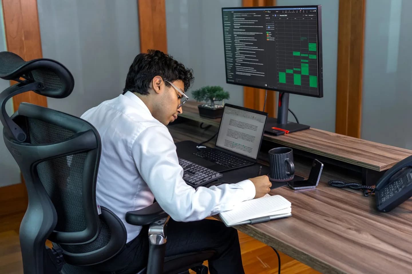 textsniper vs live text: a person reviewing data on an office computer