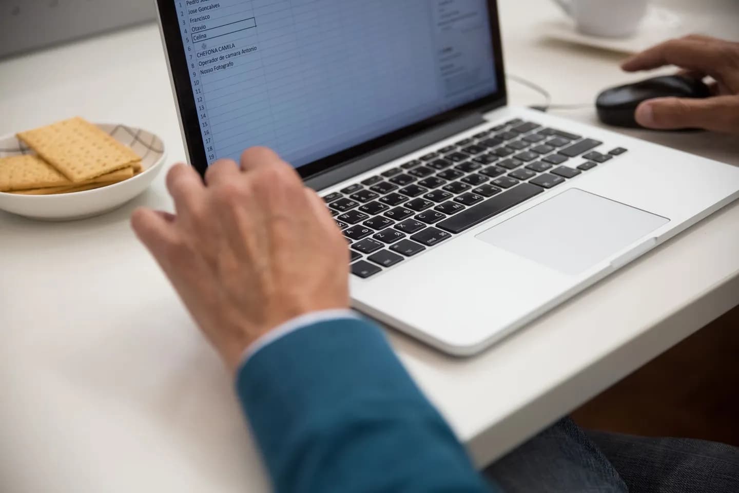 how to redact text before using chatgpt: a person using a laptop at a desk